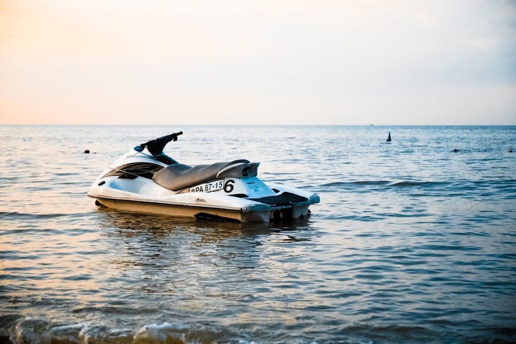 White and Black Personal Watercraft on Body of Water