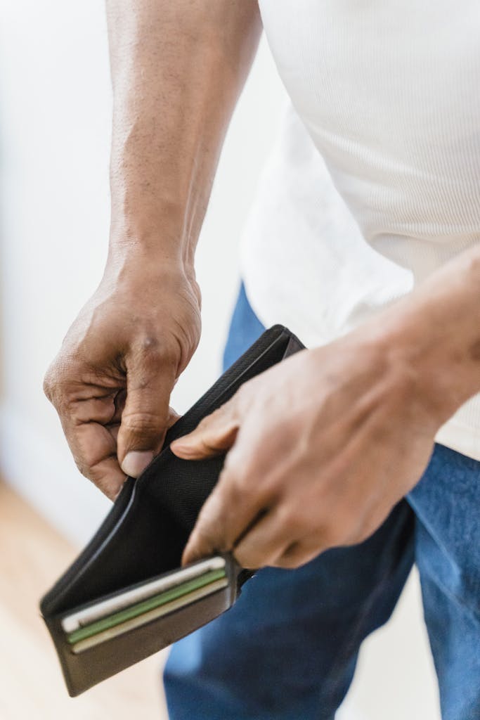 Close-up of Man with Empty Wallet